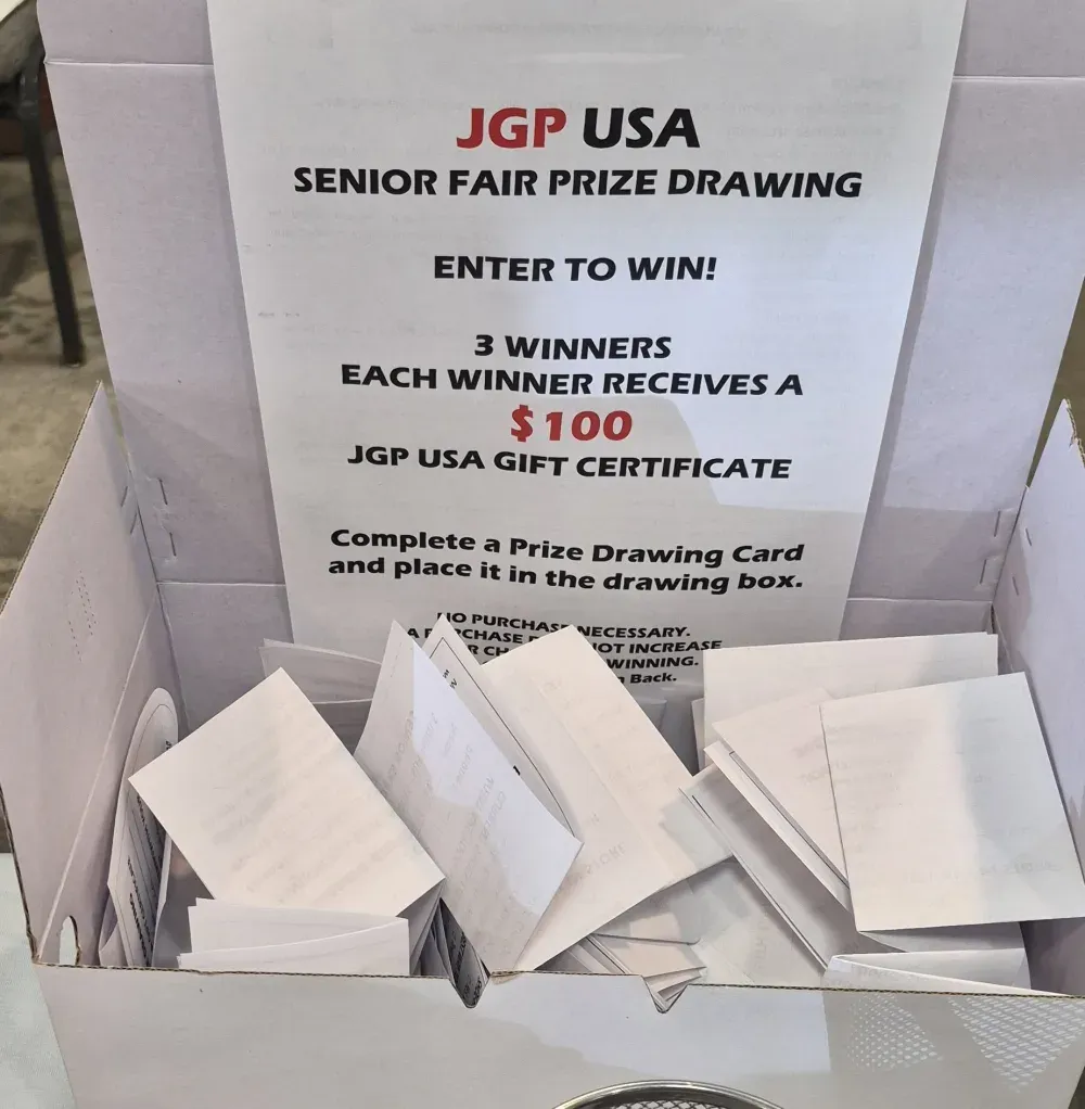 The JGP USA Senior Fair prize drawing box filled with entry cards